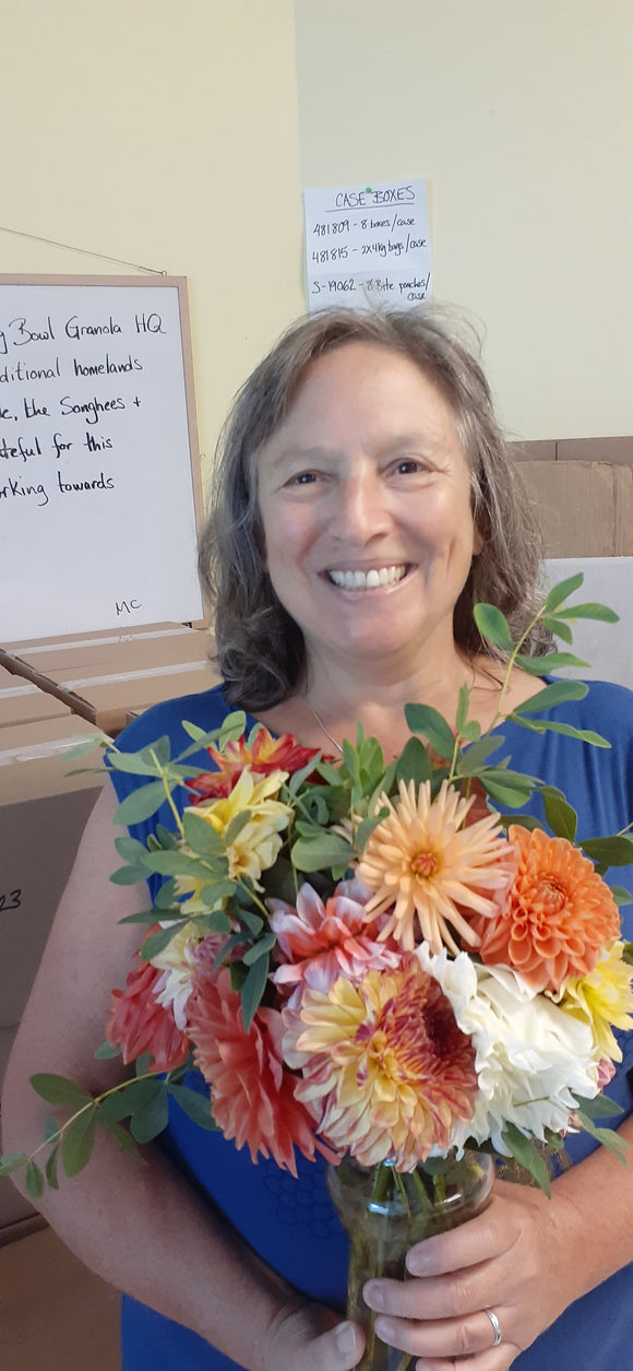 Me holding a lovely bouquet of local flowers from one of my amazing volunteers.